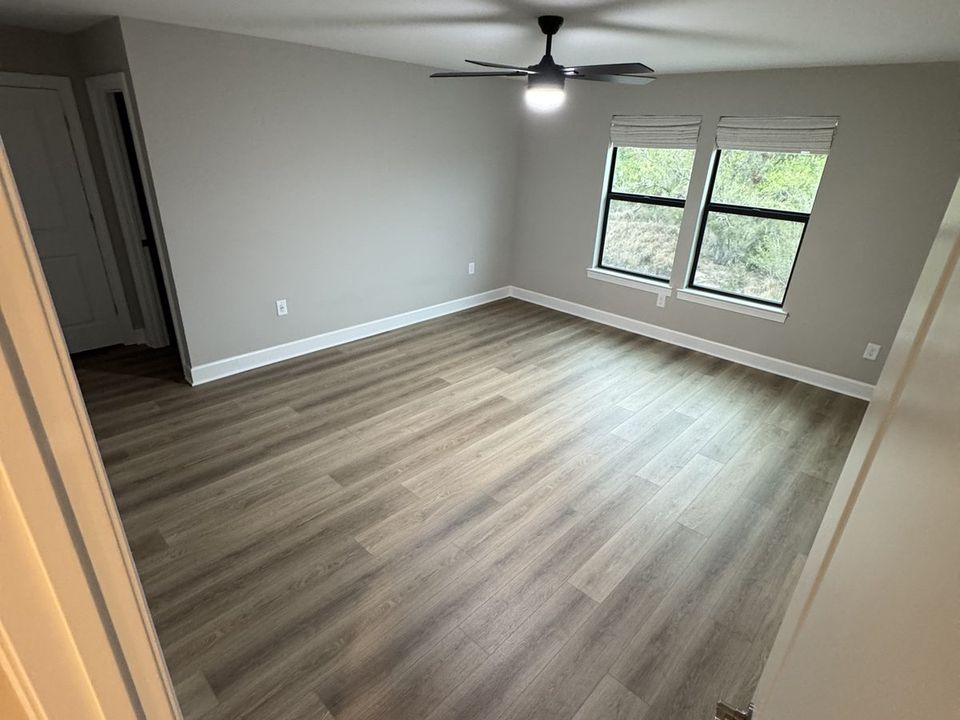 Luxury vinyl plank flooring installed in the bedroom of a Florida rental property