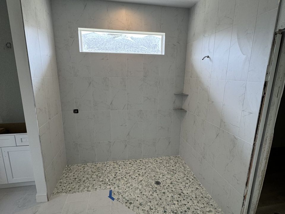 Porcelain tile floor installed in a condo bathroom on Florida's Gulf Coast